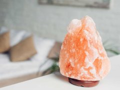 A Himalayan salt lamp emitting a warm and soothing glow, creating a tranquil and inviting ambiance